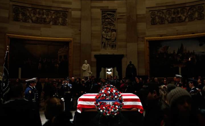Former US President George HW Bush’s last remains took their place in the American flag-draped casked in Capitol rotunda for three days of mourning in a solemn ceremony. Image: AP