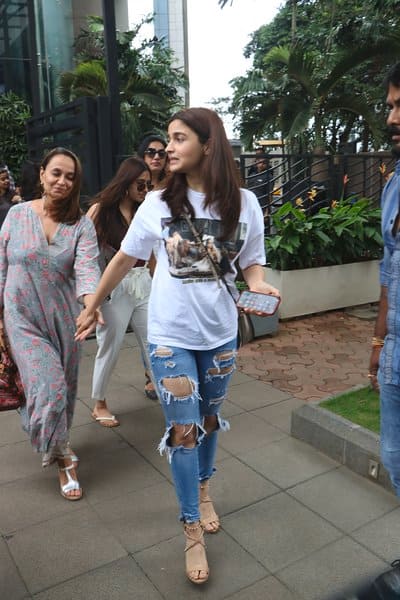 Alia, like a protective daughter can be seen holding her mother's hands while walking out.