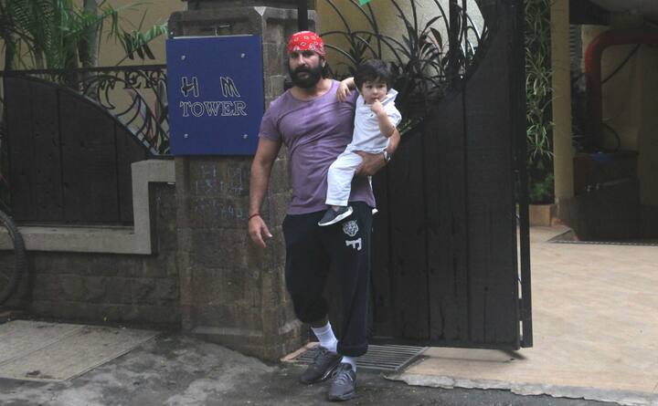 Taimur looked comfortable & relaxed in daddy Saif Ali Khan's hands. (Photo: Manav Manglani)