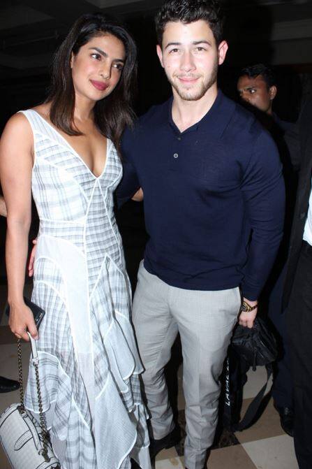 Priyanka Chopra looked chic and classy in a white-grey check dress and Nick opted for Navy blue t-shirt with grey trousers.