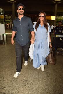 In Pics: Neha Dhupia flaunts her baby bump as she walks hand-in-hand with hubby Angad Bedi at airport