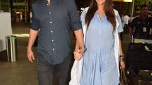 In Pics: Neha Dhupia flaunts her baby bump as she walks hand-in-hand with hubby Angad Bedi at airport