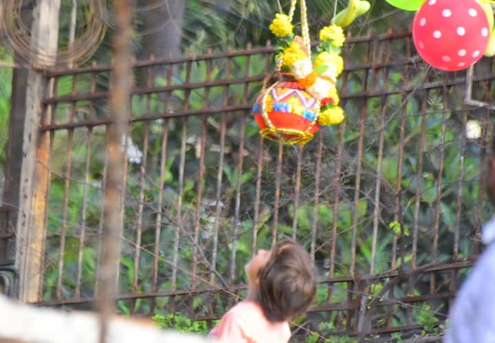 The pictures of Abram trying to reach for the handi during Janmashtmi 2018 celebrations inside the Mannat garden are too adorable for words.