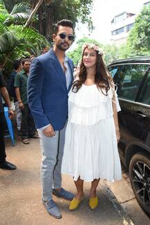 PICS: Pregnant Neha Dhupia glows as she poses with hubby Angad Bedi at her baby shower!