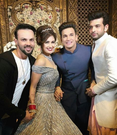 Prince & Yuvika's industry friends including Kishwet Merchantt, Anusha Dandekar, Priyank Sharma, Benafsha Soonawalla among others attended the couple's wedding reception. Here's a picture of Karan Kundrra posing with the newly-married couple at their reception. (Photo: Instagram)