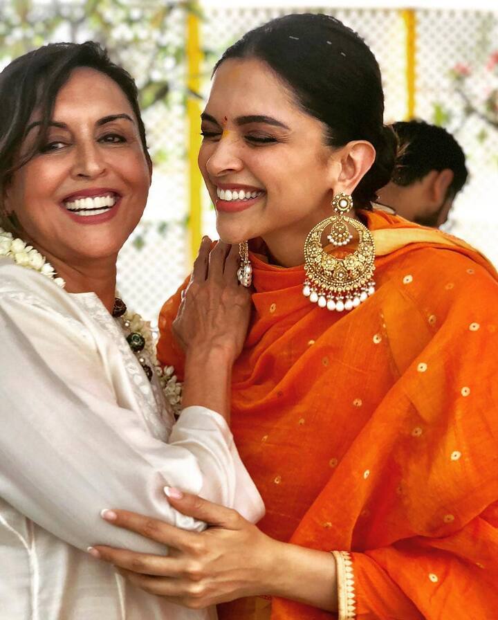 Soon-to-be bride Deepika looked stunning in an orange Sabyasachi suit with big gold earrings & tight bun. (Photo: Instagram)