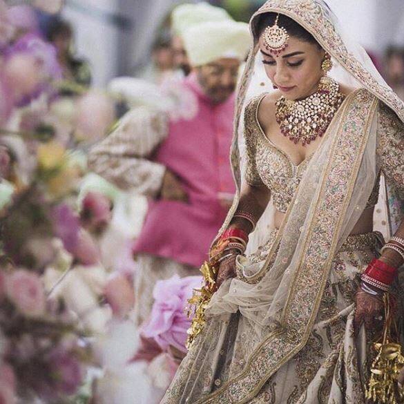 Amrita Puri looked splended as she wore a heavily embroidered Sabyasachi lehenga for her wedding. The ‘Aisha’ actress tied the knot with Imrun Sethi in Bangkok.