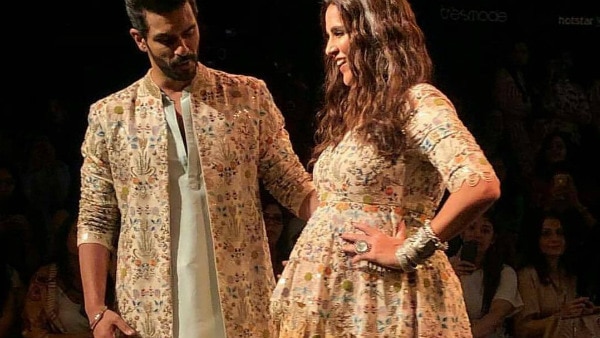 Neha Dhupia flaunts baby bump as she walks the ramp with hubby Angad Bedi at 'Lakme Fashion Week 2018'! Neha Dhupia flaunts baby bump as she walks the ramp with hubby Angad Bedi at 'Lakme Fashion Week 2018'!