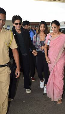 PICS: SRK & daughter Suhana walk hand-in-hand at the Airport as they leave for London!
