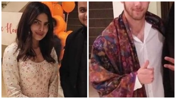 Nick Jonas spotted wearing a kashmiri shawl with Priyanka Chopra as they oblige guards for pictures! Nick Jonas spotted wearing a kashmiri shawl with Priyanka Chopra as they oblige guards for pictures!