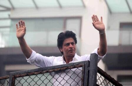 Bollywood actor Shahrukh Khan waves towards his fans on occasion of Eid al-Fitr celebrationss at his residence Mannat, in Mumbai, India on July 7, 2016. (Pravin Utturkar/SOLARIS IMAGES)