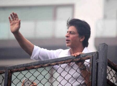 Bollywood actor Shahrukh Khan waves towards his fans on occasion of Eid al-Fitr celebrationss at his residence Mannat, in Mumbai, India on July 7, 2016. (Pravin Utturkar/SOLARIS IMAGES)