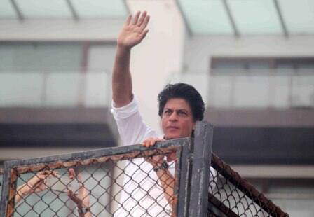 Bollywood actor Shahrukh Khan waves towards his fans on occasion of Eid al-Fitr celebrationss at his residence Mannat, in Mumbai, India on July 7, 2016. (Pravin Utturkar/SOLARIS IMAGES)