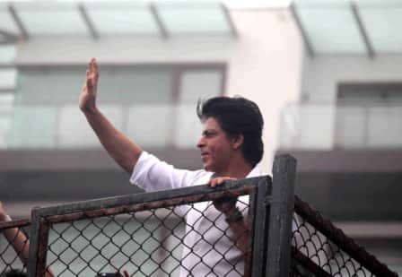 Bollywood actor Shahrukh Khan waves towards his fans on occasion of Eid al-Fitr celebrationss at his residence Mannat, in Mumbai, India on July 7, 2016. (Pravin Utturkar/SOLARIS IMAGES)