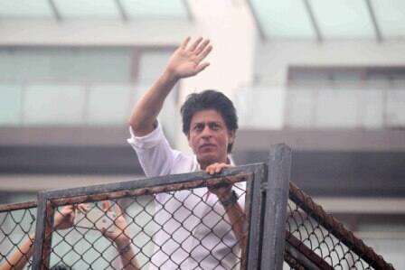 Bollywood actor Shahrukh Khan waves towards his fans on occasion of Eid al-Fitr celebrationss at his residence Mannat, in Mumbai, India on July 7, 2016. (Pravin Utturkar/SOLARIS IMAGES)