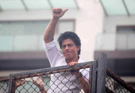 Bollywood actor Shahrukh Khan waves towards his fans on occasion of Eid al-Fitr celebrationss at his residence Mannat, in Mumbai, India on July 7, 2016. (Pravin Utturkar/SOLARIS IMAGES)