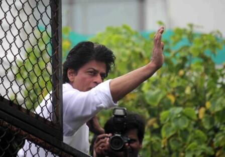 Bollywood actor Shahrukh Khan waves towards his fans on occasion of Eid al-Fitr celebrationss at his residence Mannat, in Mumbai, India on July 7, 2016. (Pravin Utturkar/SOLARIS IMAGES)
