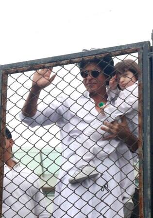Bollywood actor Shahrukh Khan along with his son AbRam during the Eid al-Fitr celebration at his residence Mannat, in Mumbai, India on July 7, 2016. (SOLARIS IMAGES)