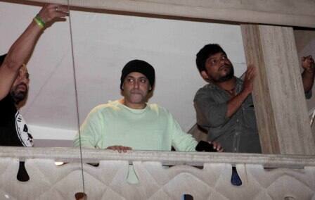 Bollywood actor Salman Khan waves towards his fans on occasion of Eid al-Fitr celebrations at his residence, in Mumbai, India on July 7, 2016. (Nikesh Gurav/ SOLARIS IMAGES)