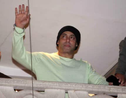 Bollywood actor Salman Khan waves towards his fans on occasion of Eid al-Fitr celebrations at his residence, in Mumbai, India on July 7, 2016. (Nikesh Gurav/ SOLARIS IMAGES)