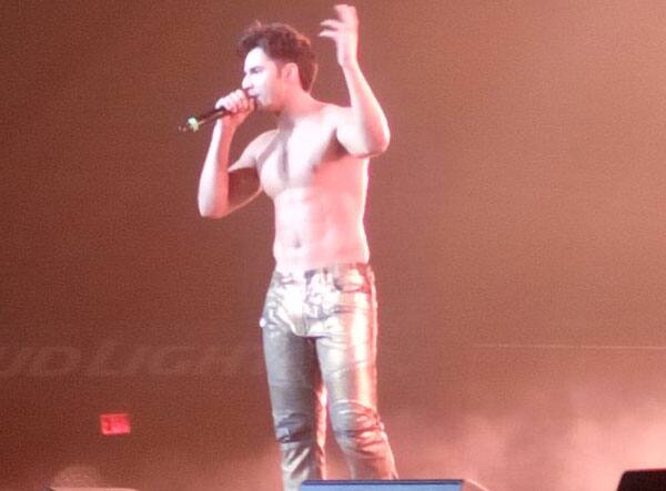 Varun Dhawan flaunts his hot body and killer abs on-stage