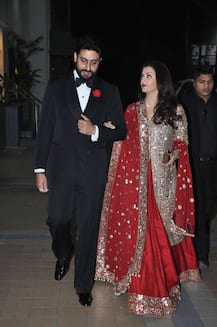 PHOTOS: Aishwarya Rai looks RAVISHING in red as she attends her stylist's WEDDING with hubby Abhishek Bachchan!