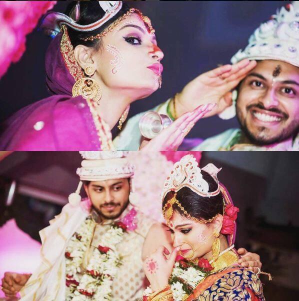 Dimply looks all happy with her husband.