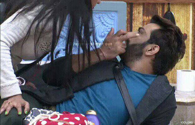 Manu was showing something to Mona on her face and she was bending over him