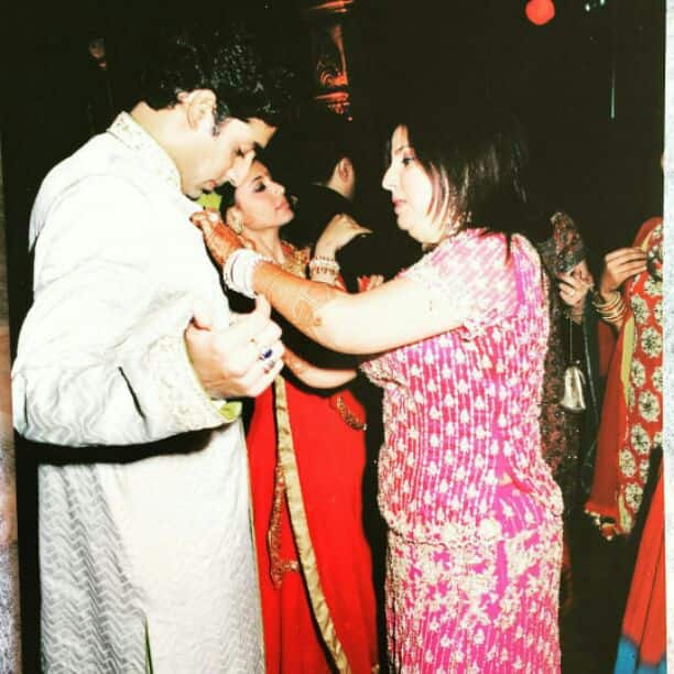 Here's one which is gaining most attention. Farah is seen settling Abhishek's kurta and she captions it, 