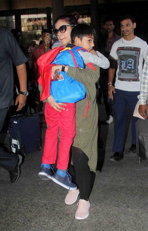Bollywood actor Kajol with her son Yug Devgan arrive at the airport after the New Year celebrations in Mumbai, India on January 3, 2017. (Pravin Utturkar/ SOLARIS IMAGES)