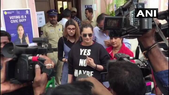 India's tennis champion Sania Mirza on Friday reached at the Film Nagar Cultural Center in Hyderabad to cast her vote to elect the new government in Telangana. She was spotted by reporters standing outside the polling booth. (Image: ANI)