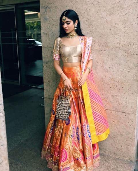 She looked drop-dead-gorgeous in this bright lehenga for the day wedding