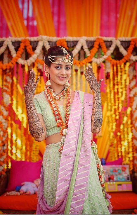 Rukmini looked pretty in a light green lehenga and her mehendi was adding more colours ot her beauty. (Photo: Facebook/ The Wedding Story)