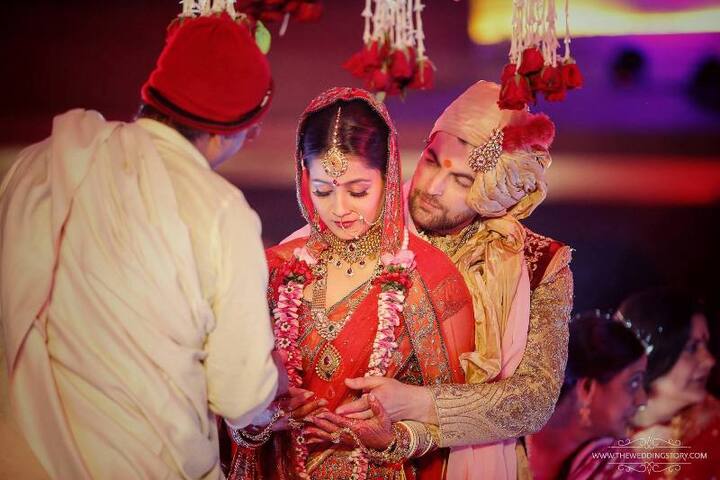 The ceremony was attended by family and close friends at a five-star hotel in the City of Lakes. The ‘New York’ actor looked regal in a cream and maroon sherwani while the bride looked gorgeous in a red and orange lehenga.(PIC CREDIT: The Wedding Story)