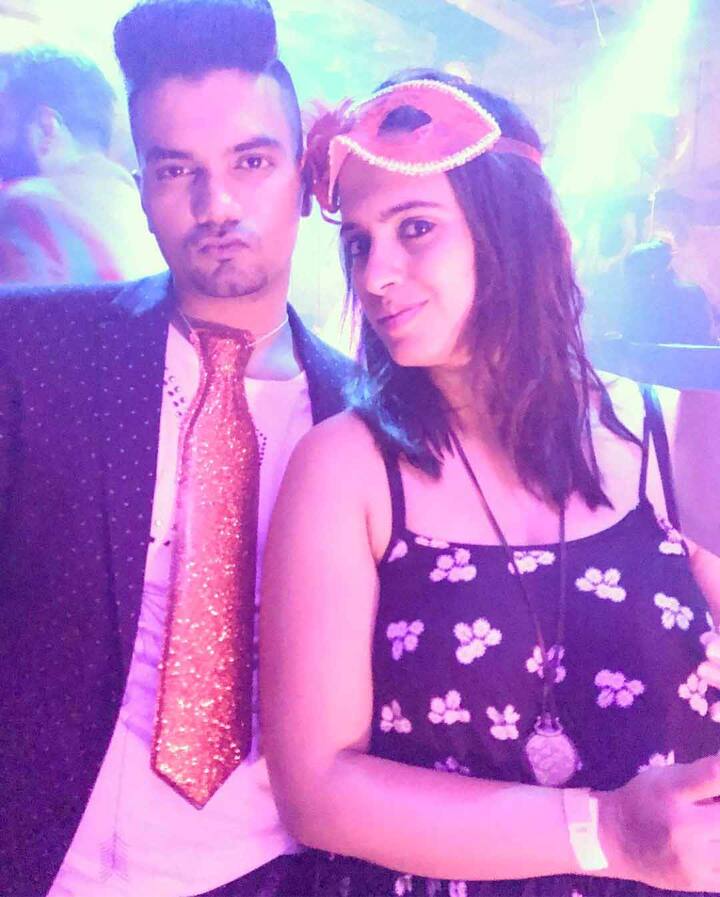 Dapper looking Rocky posing with another friend at the same party