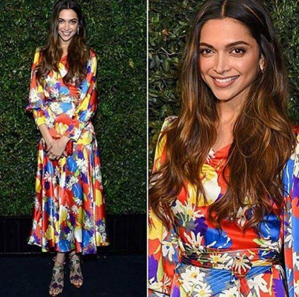 Deepika looks stunning in multi-coloured printed dress with dazzling Louboutin sandals.