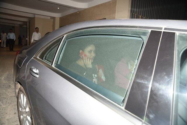 Taimur is cradled in a lady's arms (most probably his nanny) while Kareena can be seen sitting right next to them in the same car. (Photo: Manav Manglani)
