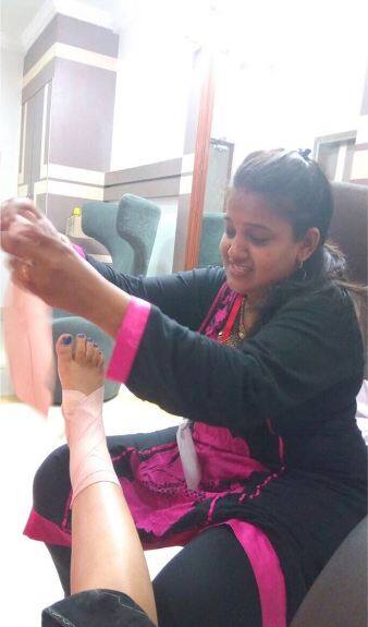 The physiotherapist attending to Aman's twisted leg 