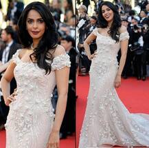 CANNES 2017: IN PICS- After Deepika Padukone, Mallika Sherawat impresses at the RED CARPET; Bollywood bombshell looks ravishing in an embellished ivory trailed gown!