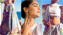 Cannes 2017: Fashionista Sonam Kapoor makes her first appearance looking RAVISHING as ever in a prismatic saree!