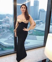 SEE PICS: Yummy Mummy Kareena Kapoor Khan DAZZLES in a figure-hugging gold & black gown in Malaysia!