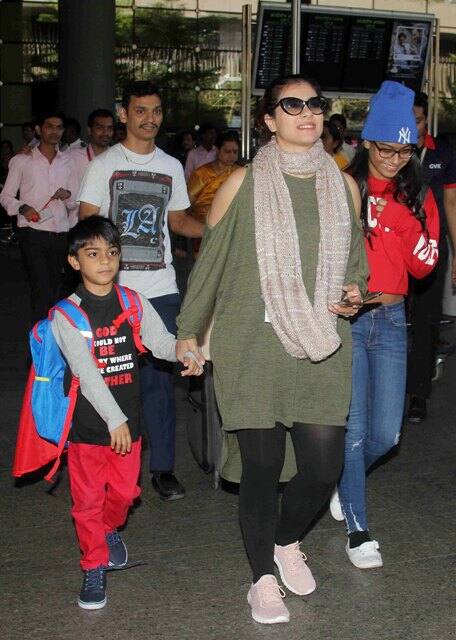 Kajol with both her children spotted at an airport early this year