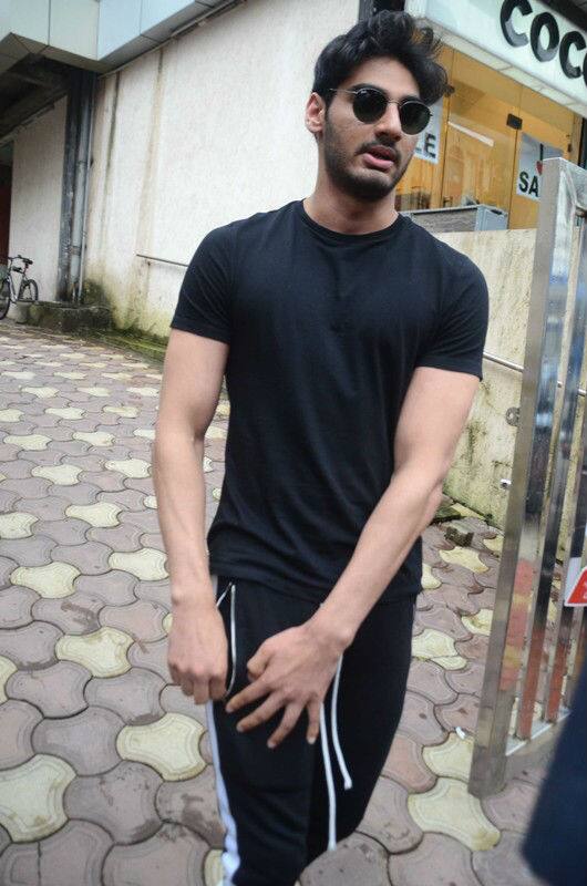 Ahan was probably coming out from his gym wearing track pants, black T shirt & sneakers looking just like his daddy
