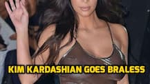 SEE PICS: Kim Kardashian goes BRALESS in SHEER metallic dress & thigh high silver BOOTS!