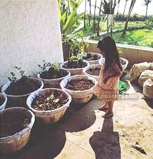 20 ADORABLE PICS: Daughter Nitara putting nail paint on Akshay Kumar's toe... Helping Mom Twinkle in gardening...! Check them all out!