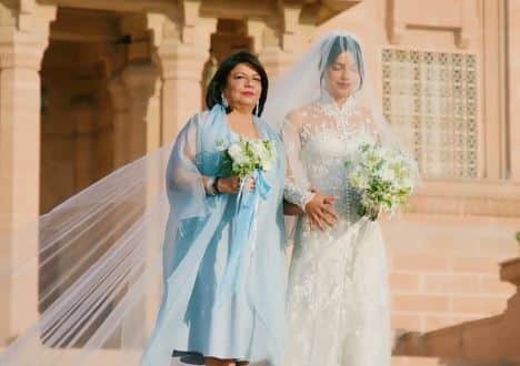 For her white wedding Priyanka wore a hand-beaded and embroidered Ralph Lauren gown with a stunning 75-foot long veil, was escorted down the aisle by her mother Madhu (as her father Ashok died of cancer in 2013).[pic credit: People]