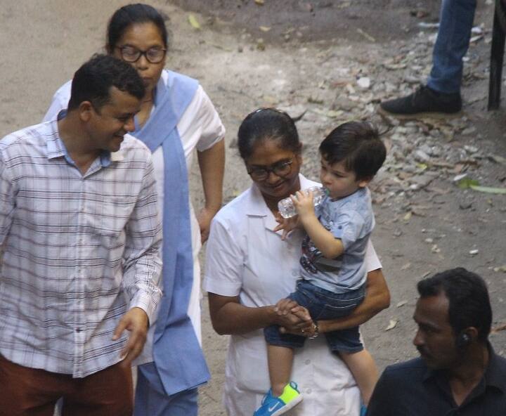 Taimur who even has a doll inspired by him in the market, was busy drinking water from his bottle while the man can't take his eye off the cute-beyond-words kiddo.