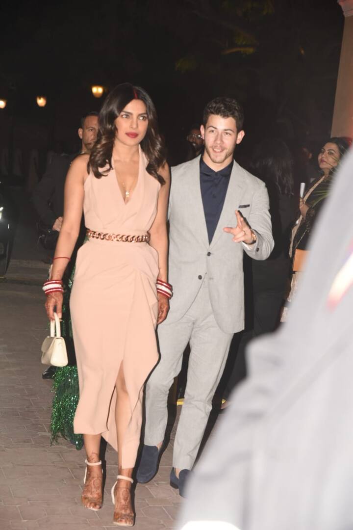 Wearing a pastel colored dress Priyanka was accompanied by her husband Nick Jonas who looked dapper in a grey suit.