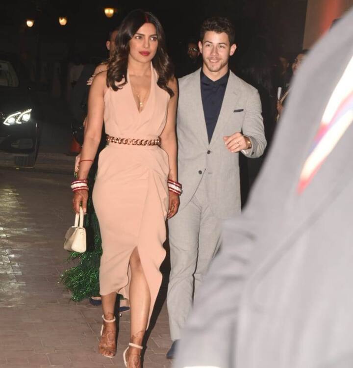 The newlywed gorgeous couple Nickyanka just appeared at an event in Delhi and the new bride sported sindoor in her hair parting and flaunted her mehendi on hands and feet with chooda in hands too.
