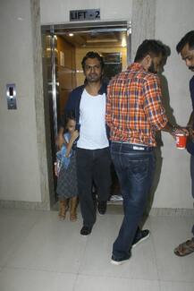 SEE PICS: Nawazuddin Siddiqui's super-cute daughter hides from paparazzi during 'Munna Michael' screening!